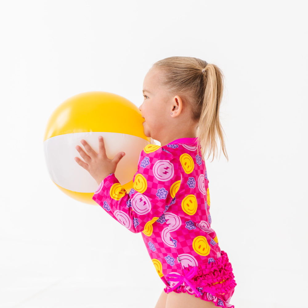 
                      
                        Electric Smiles Long Sleeve Ruffle Swimsuit
                      
                    