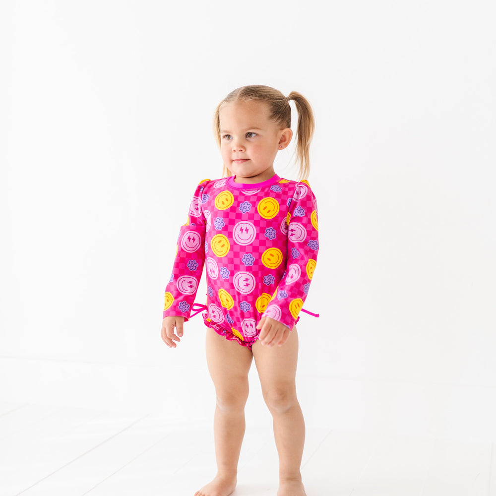 
                      
                        Electric Smiles Long Sleeve Ruffle Swimsuit
                      
                    