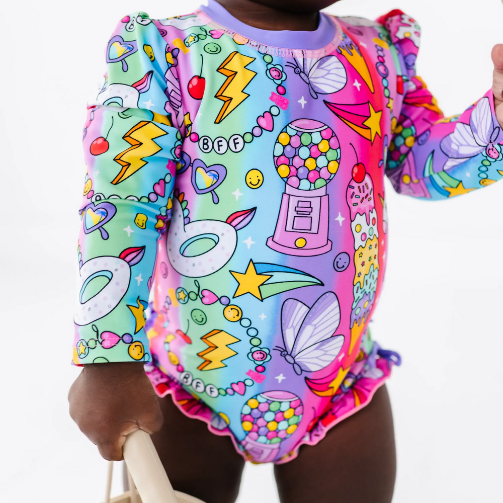 
                      
                        Cosmic Candyland Long Sleeve Ruffle Swimsuit
                      
                    