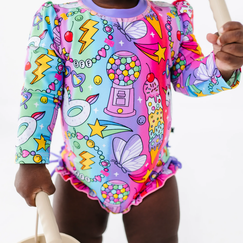 
                      
                        Cosmic Candyland Long Sleeve Ruffle Swimsuit
                      
                    