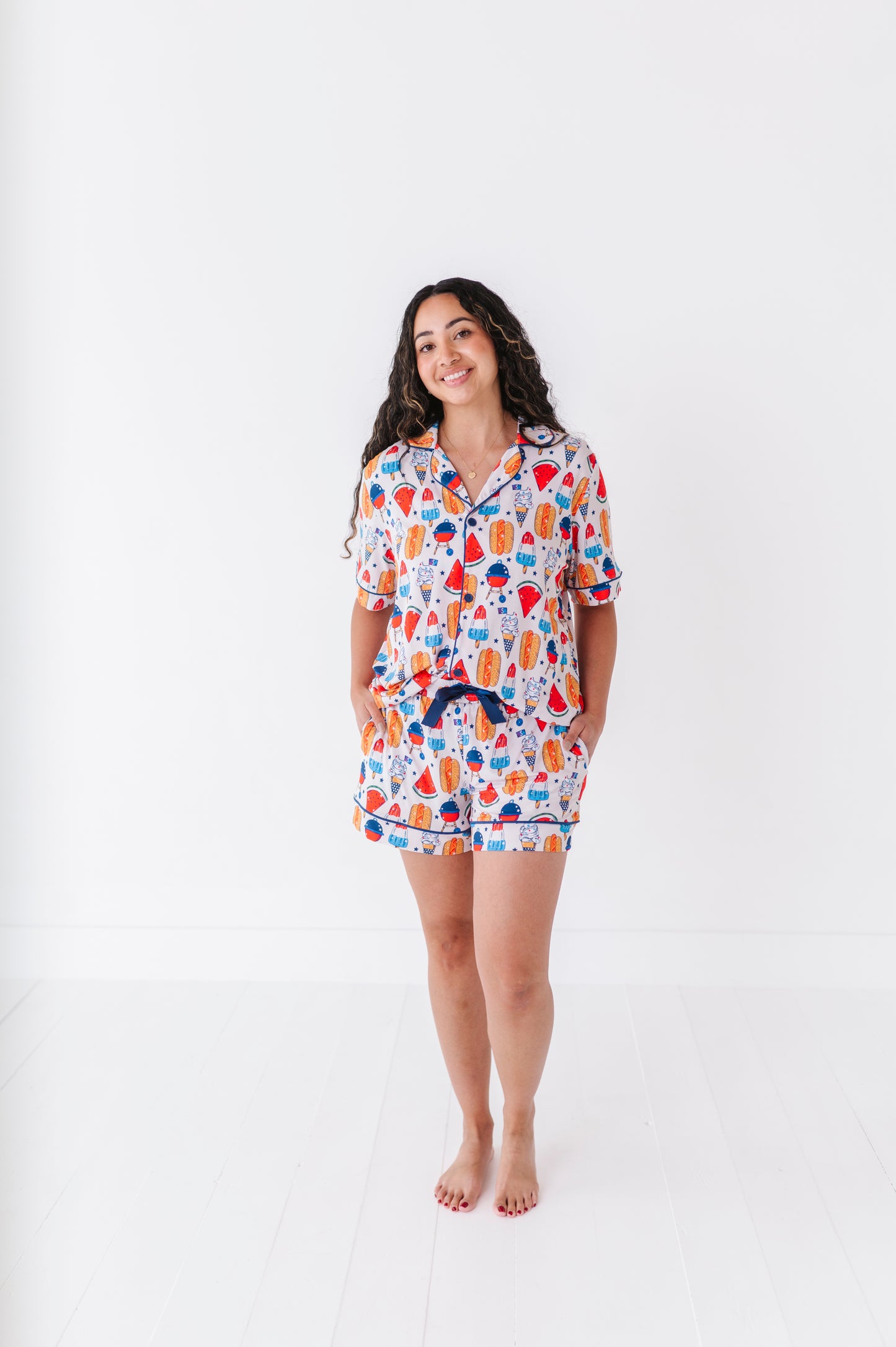 Mom wearing 4th of July hot dog pajamas made from soft bamboo fabric, perfect for matching family sets