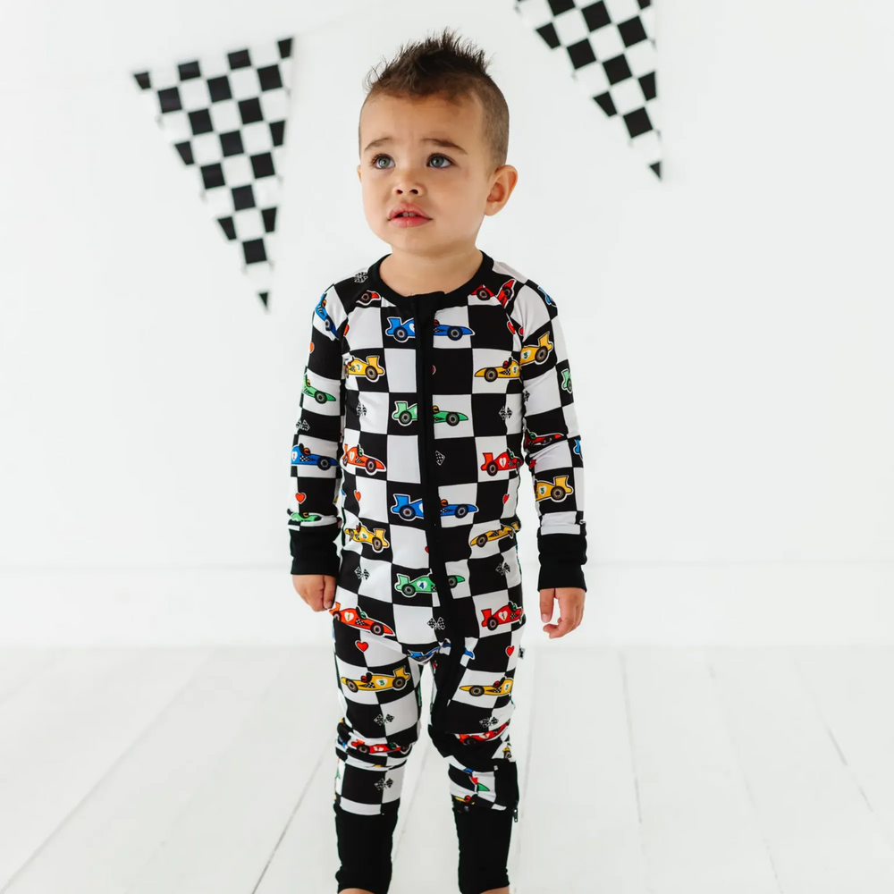 
                      
                        Kid in Racecar checkered footies by Kiki and Lulu
                      
                    