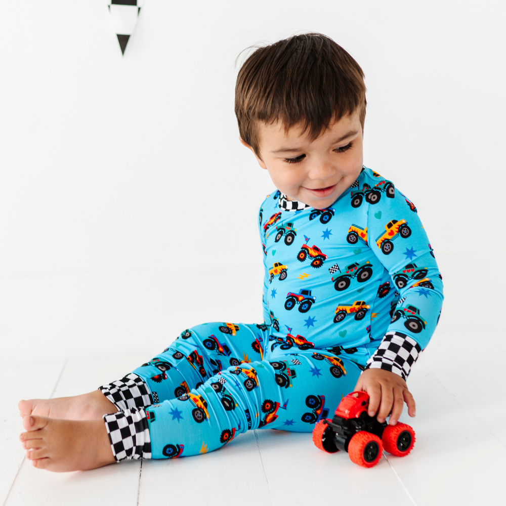 
                      
                        Boy in monster truck pajamas by Kiki and Lulu
                      
                    