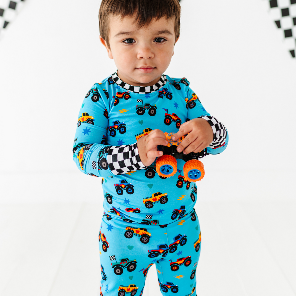 
                      
                        Boy in monster truck pajamas by Kiki and Lulu
                      
                    