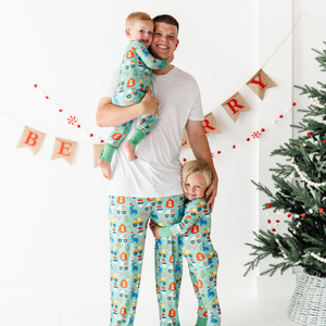 Toddler in Blue Christmas pajamas by Kiki and Lulu