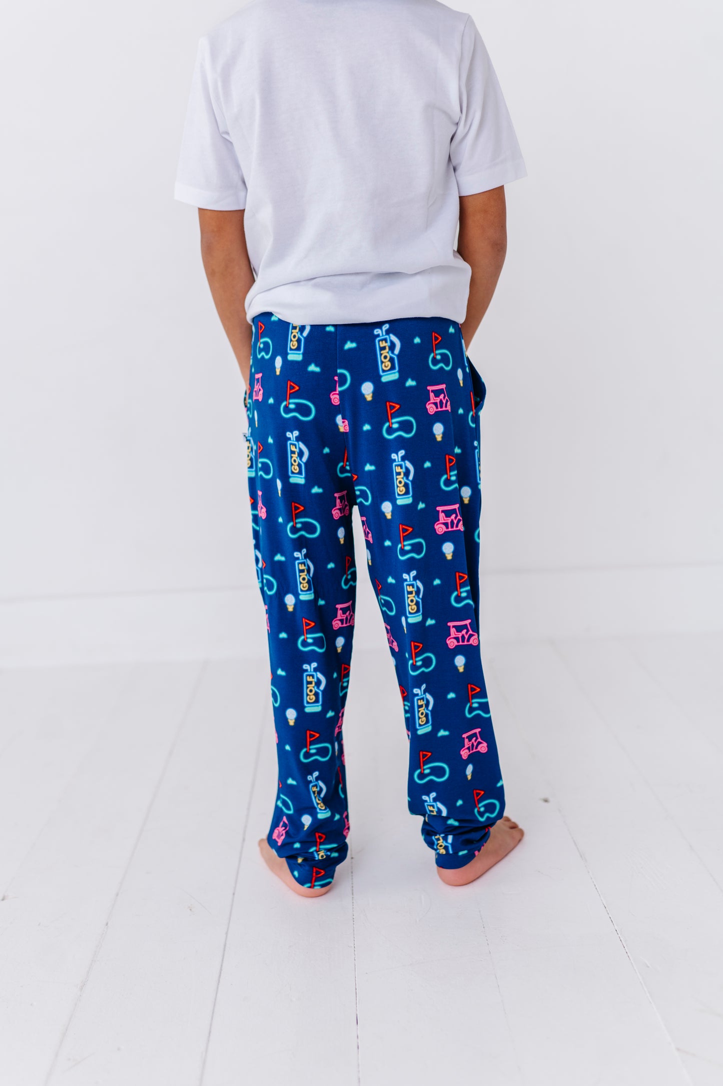 Boy Wearing Neon Golf Pajamas By Kiki Lulu