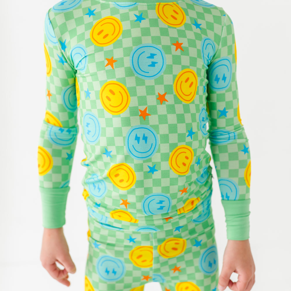 Boy wearing smiley pajamas
