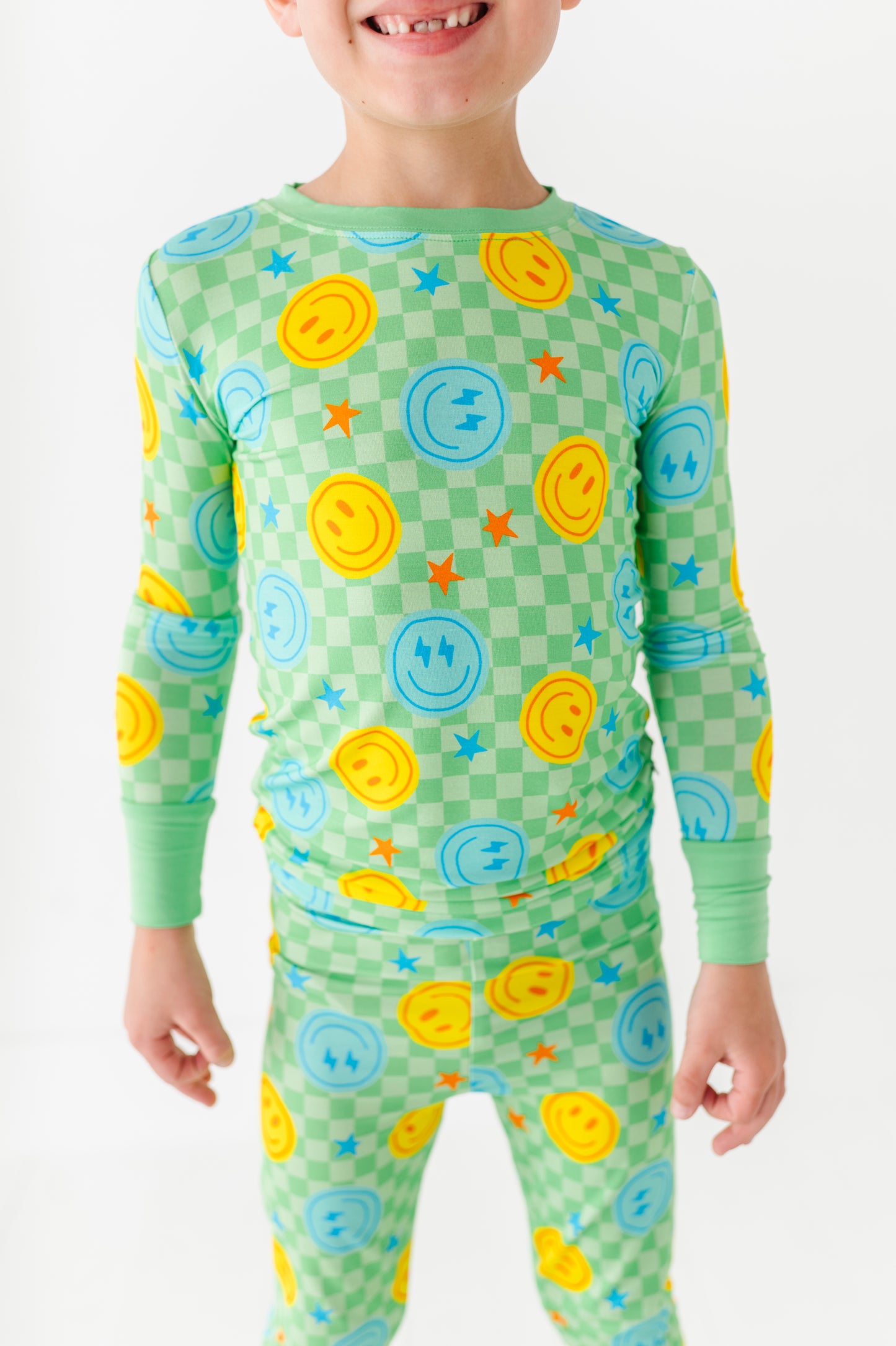 Boy wearing smiley pajamas