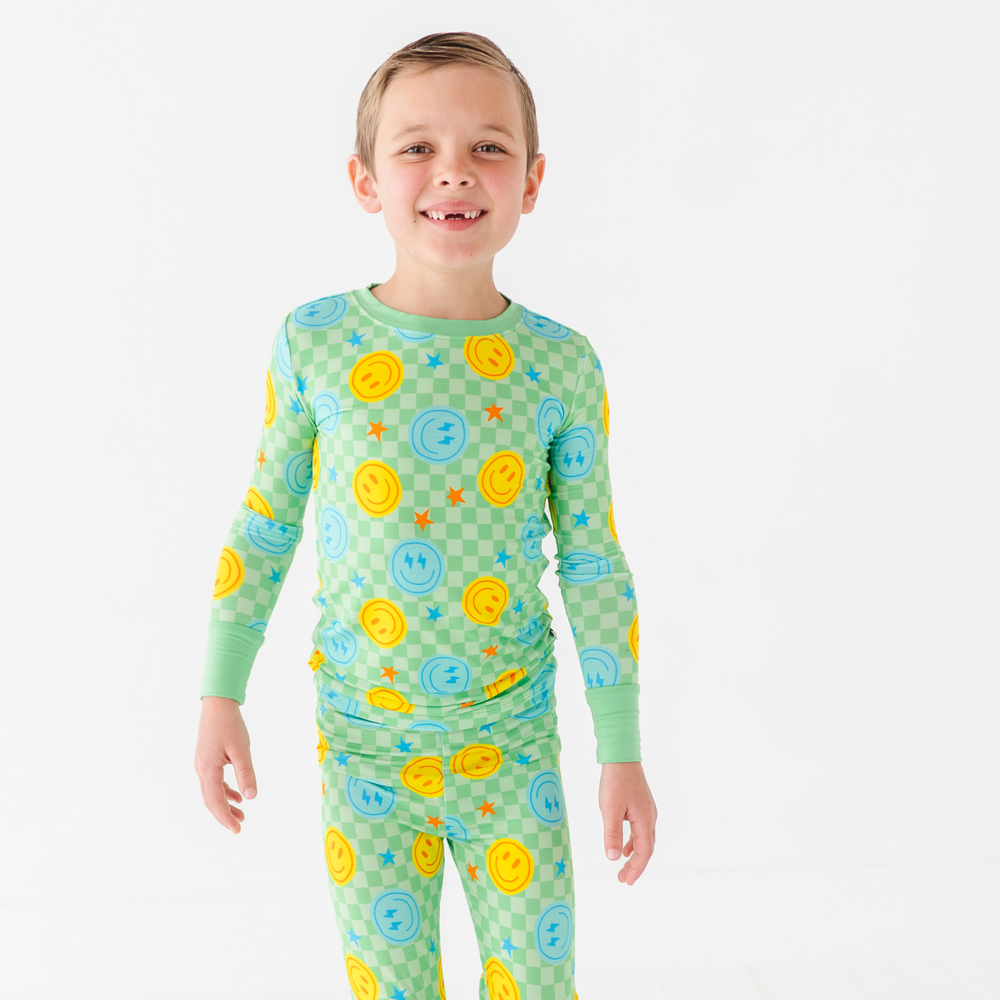 Boy in smiley pajamas