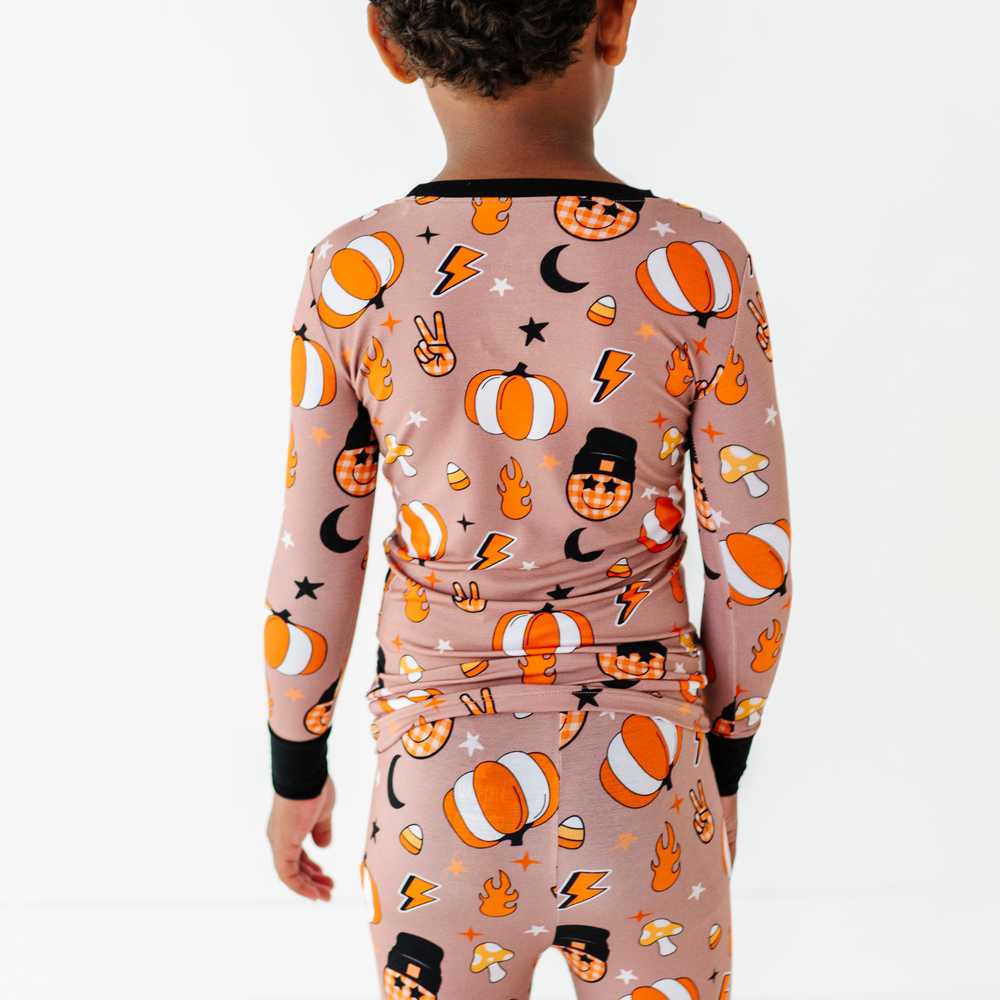 
                      
                        Boy wearing retro pumpkin pajamas by Kiki and Lulu
                      
                    