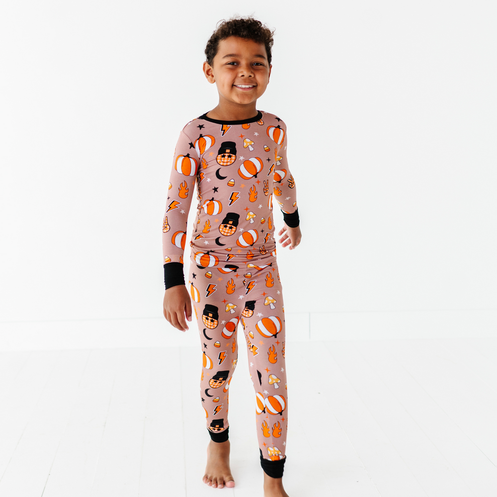 
                      
                        Boy wearing retro pumpkin pajamas by Kiki and Lulu
                      
                    