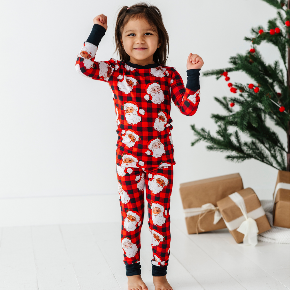 
                      
                        Girl in Buffalo Plaid Santa pajamas by kiki and lulu
                      
                    