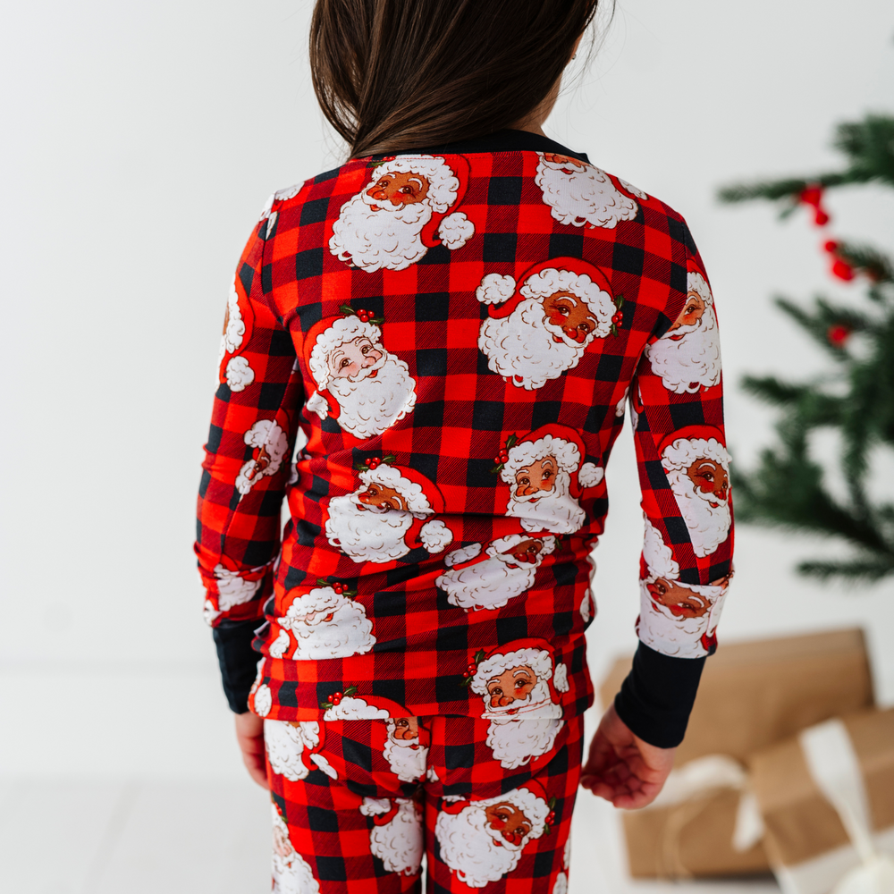 
                      
                        Girl in Buffalo Plaid Santa pajamas by kiki and lulu
                      
                    