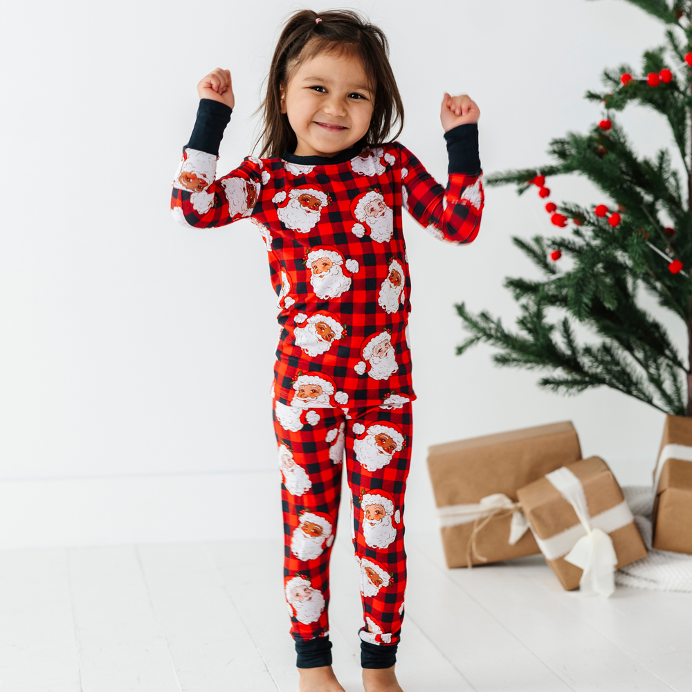 
                      
                        Girl in Buffalo Plaid Santa pajamas by kiki and lulu
                      
                    