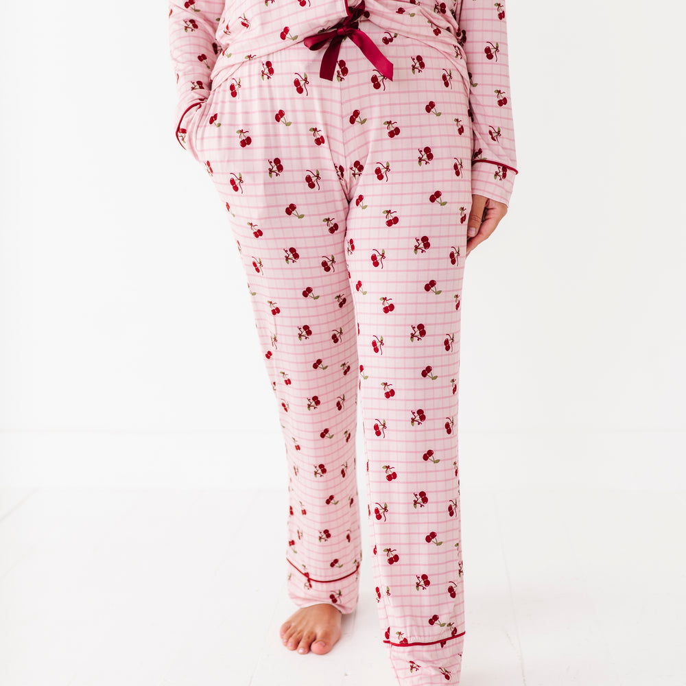 
                      
                        Person wearing a pink and white patterned pajama set on a white background
                      
                    
