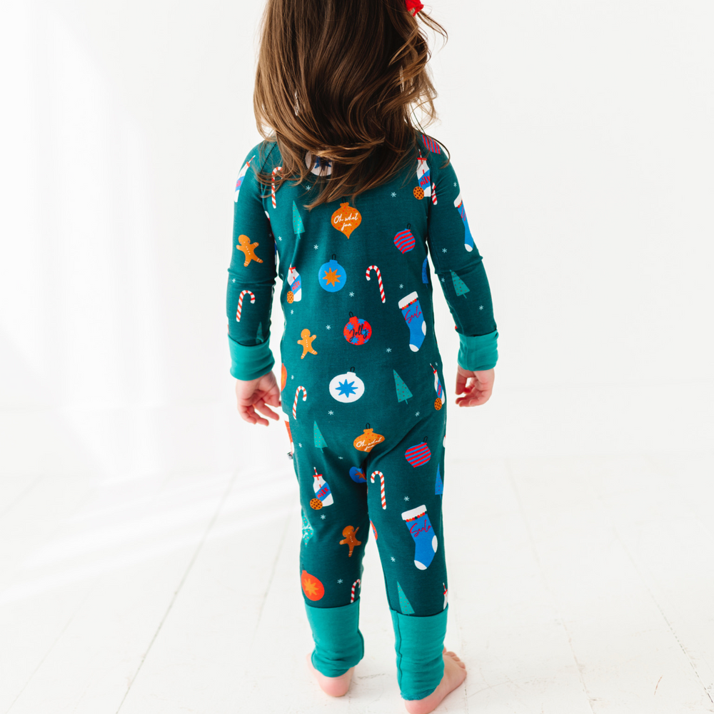 
                      
                        Girl in green Christmas footie pajamas by Kiki and Lulu
                      
                    