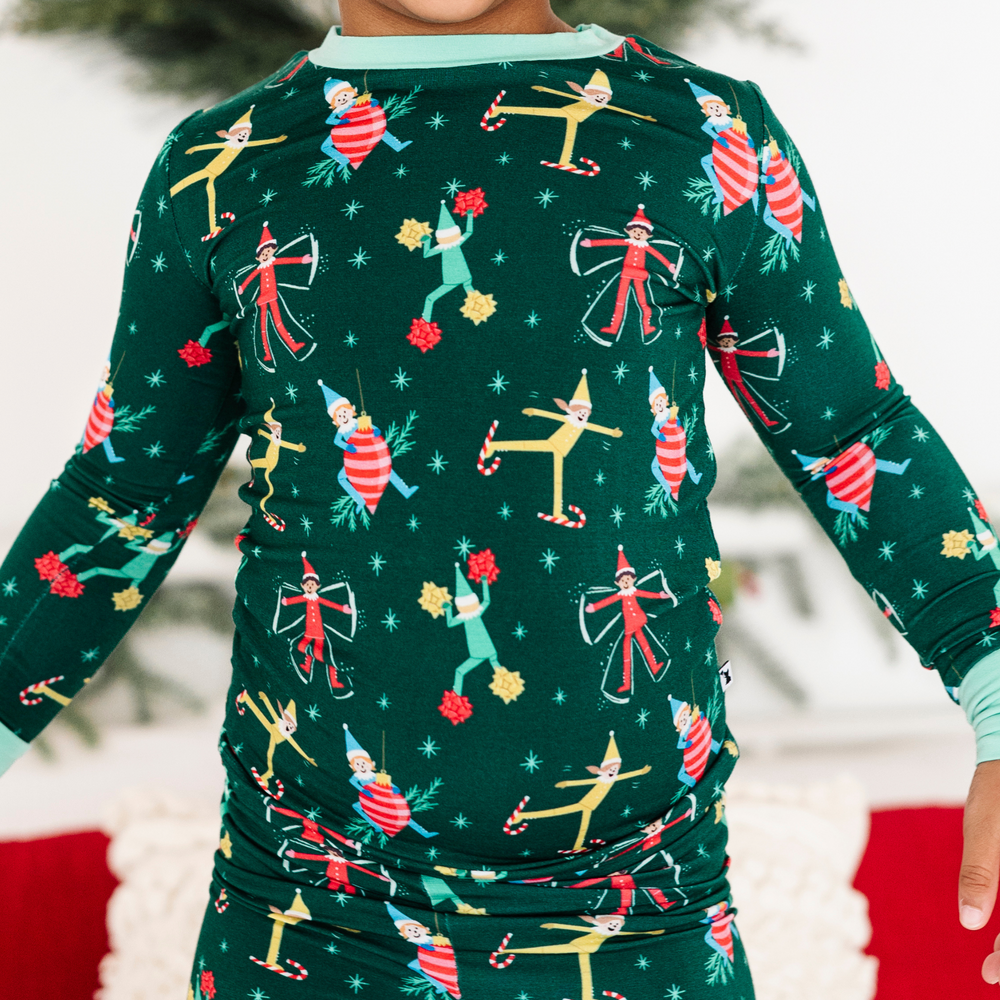 
                
                    Load image into Gallery viewer, Toddler in elf on the shelf pajamas by Kiki and Lulu
                
            