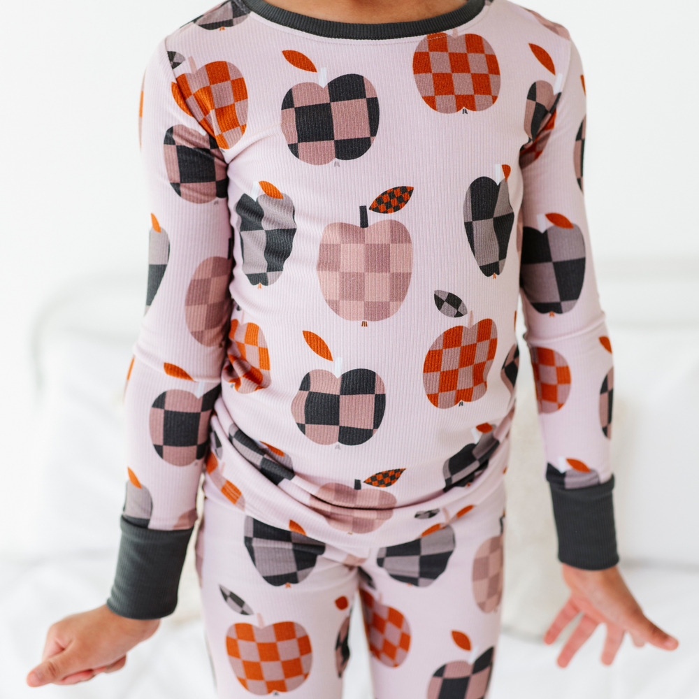 Girl Wearing Fall Apple Kids Pajamas