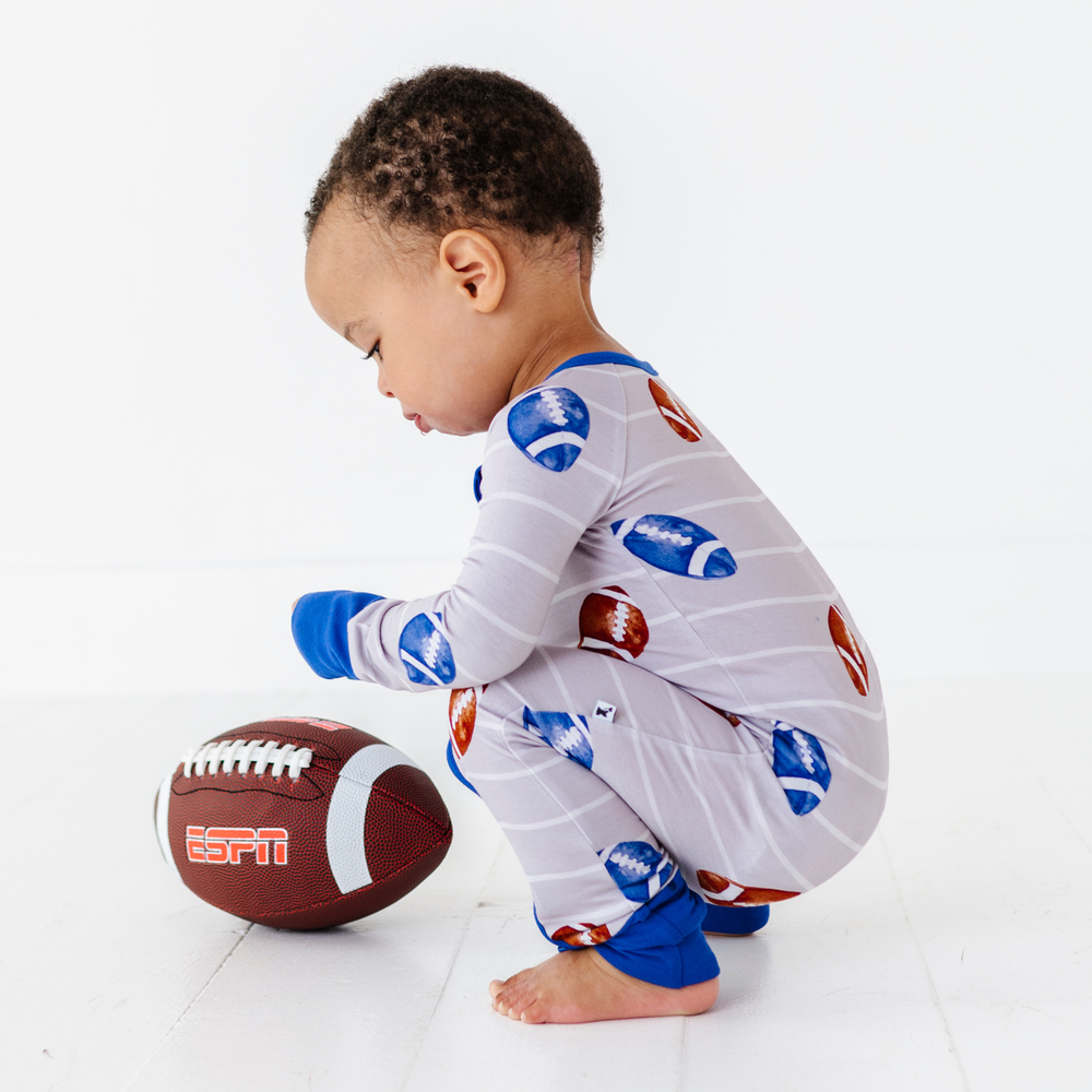 
                      
                        Boy in Football Convertible Footies by Kiki and Lulu
                      
                    