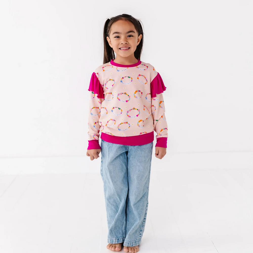 
                      
                        Friendship bracelet sweatshirt by Kiki and Lulu
                      
                    