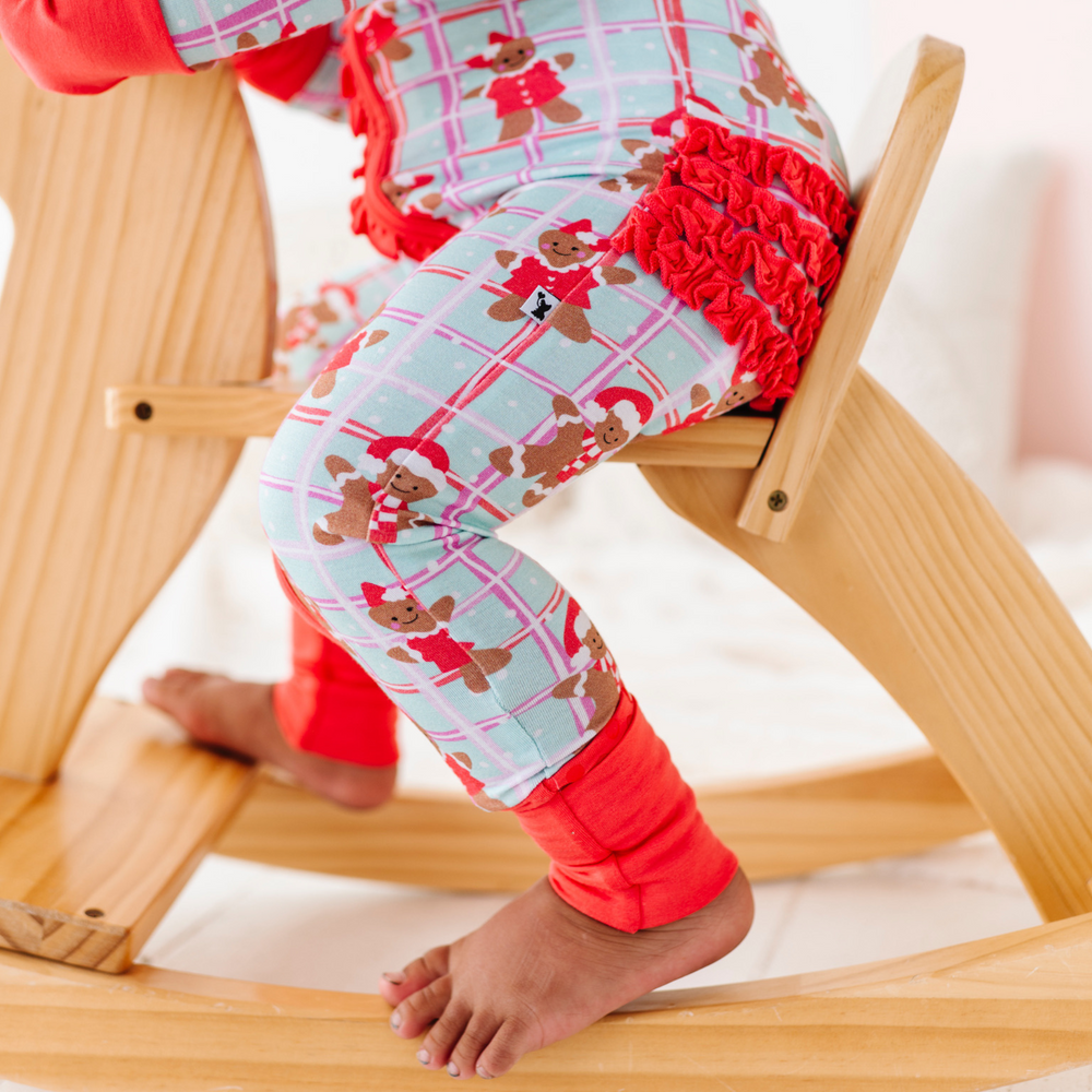 
                      
                        Girl in Gingerbread Christmas Pajamas by Kiki and Lulu
                      
                    