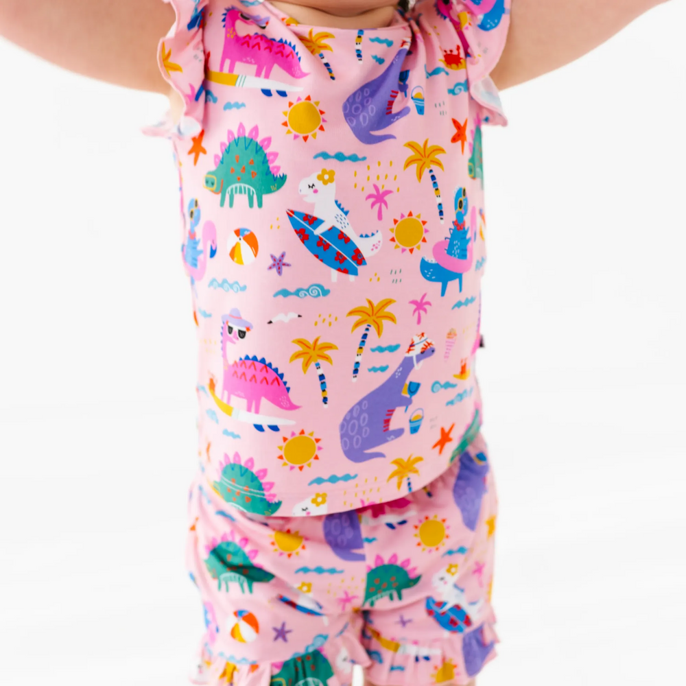 
                      
                        Girl in short pajama dinosaur set by Kiki and Lulu
                      
                    