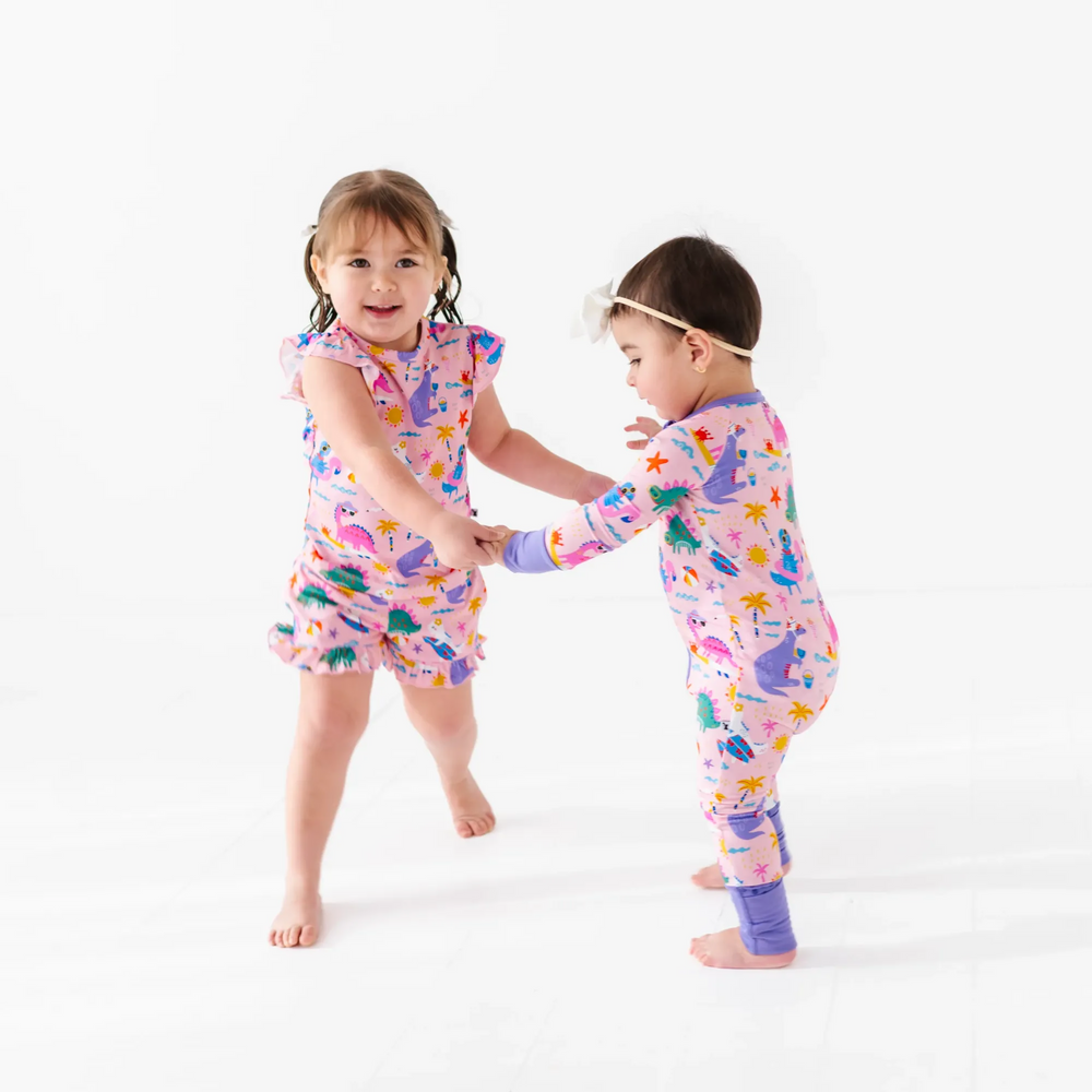 
                      
                        Girl in short pajama dinosaur set by Kiki and Lulu
                      
                    