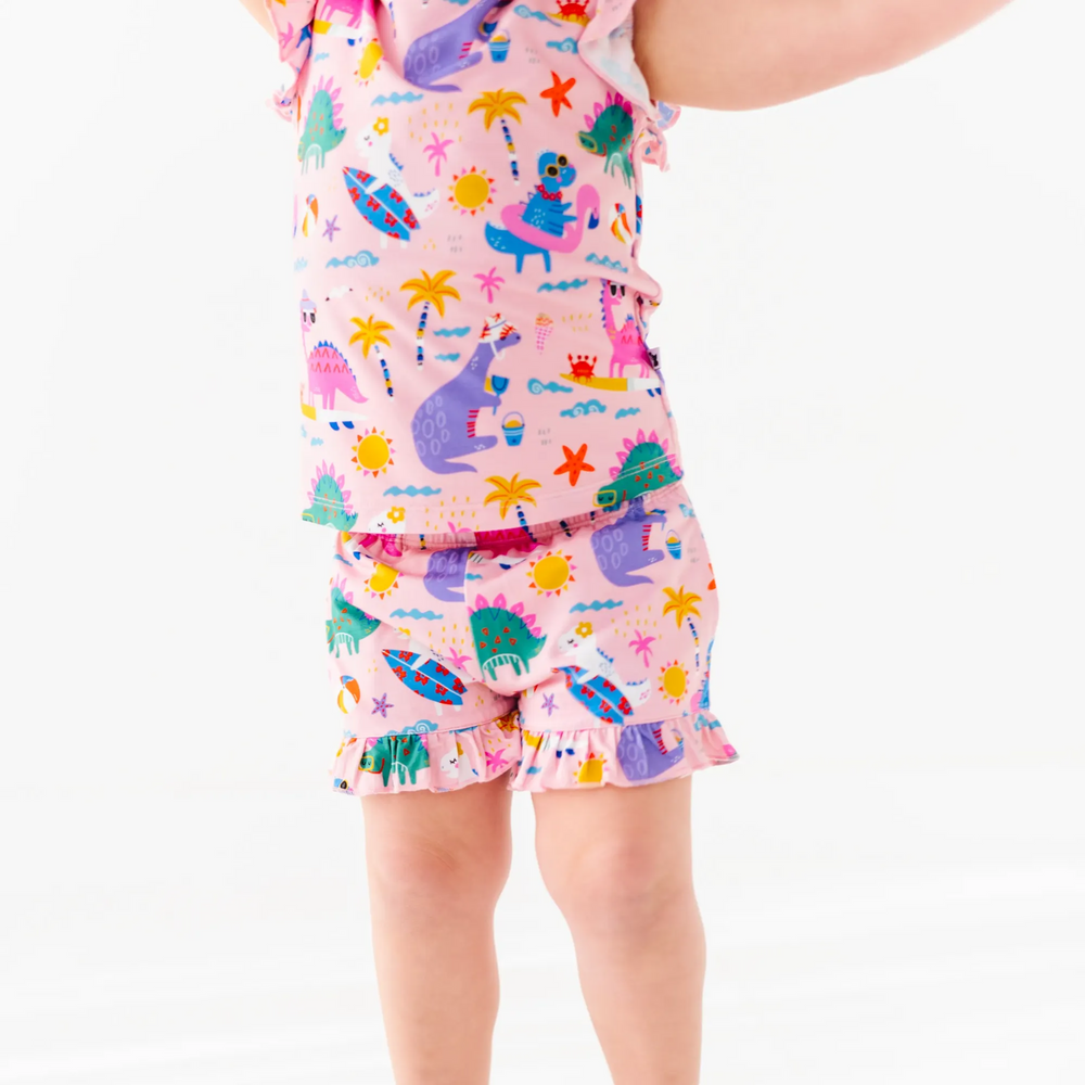 
                      
                        Girl in short pajama dinosaur set by Kiki and Lulu
                      
                    