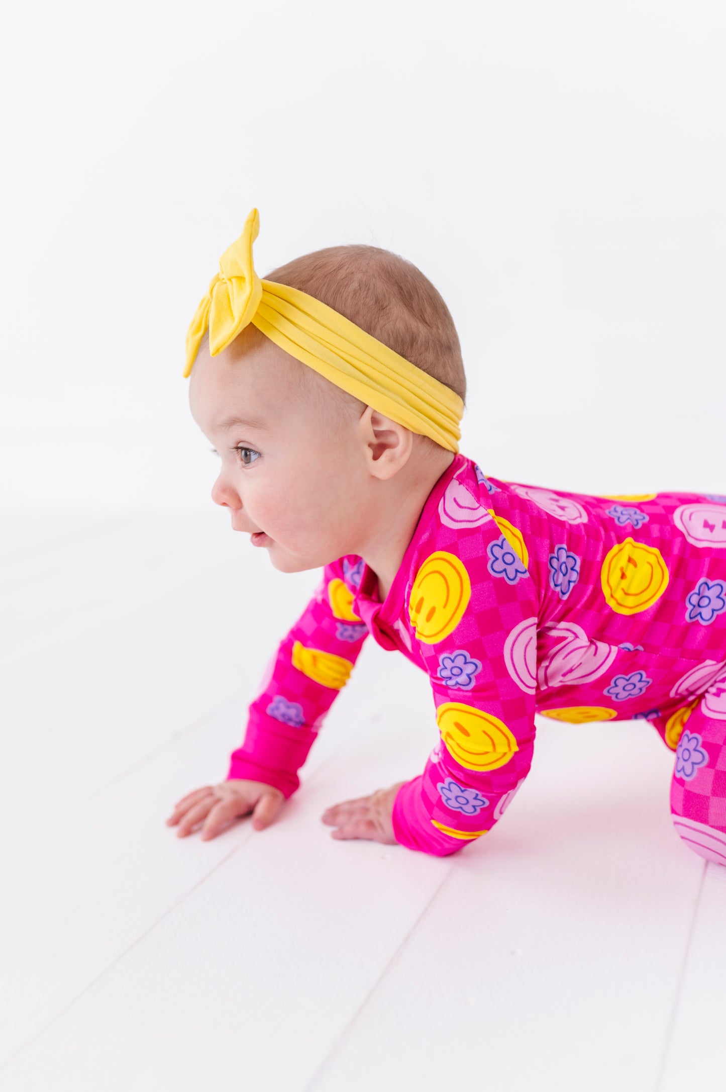 Girl Wearing Pink Smiley Footies by Kiki and Lulu