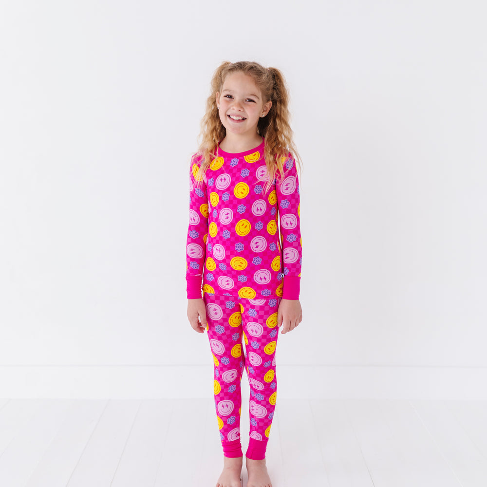 
                      
                        Girl wearing neon smiley pajamas By Kiki Lulu
                      
                    