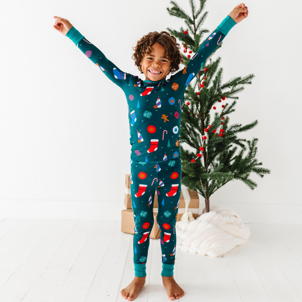 
                      
                        Boy in Green Christmas pajamas by Kiki and Lulu
                      
                    