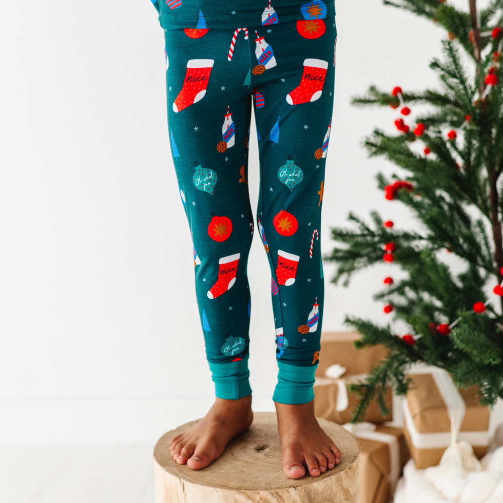 
                      
                        Boy in Green Christmas pajamas by Kiki and Lulu
                      
                    