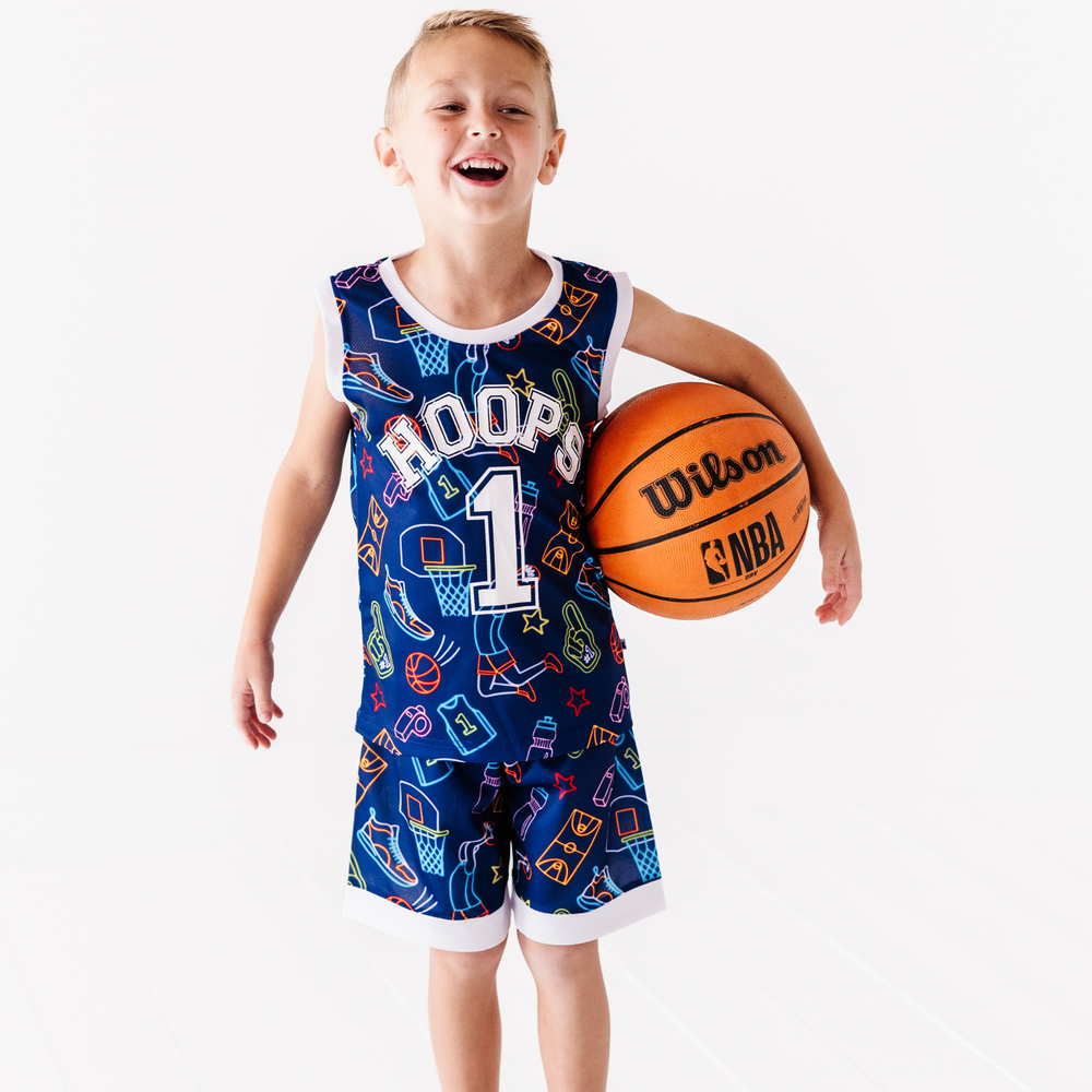 
                
                    Load image into Gallery viewer, Boy in neon basketball jersey
                
            