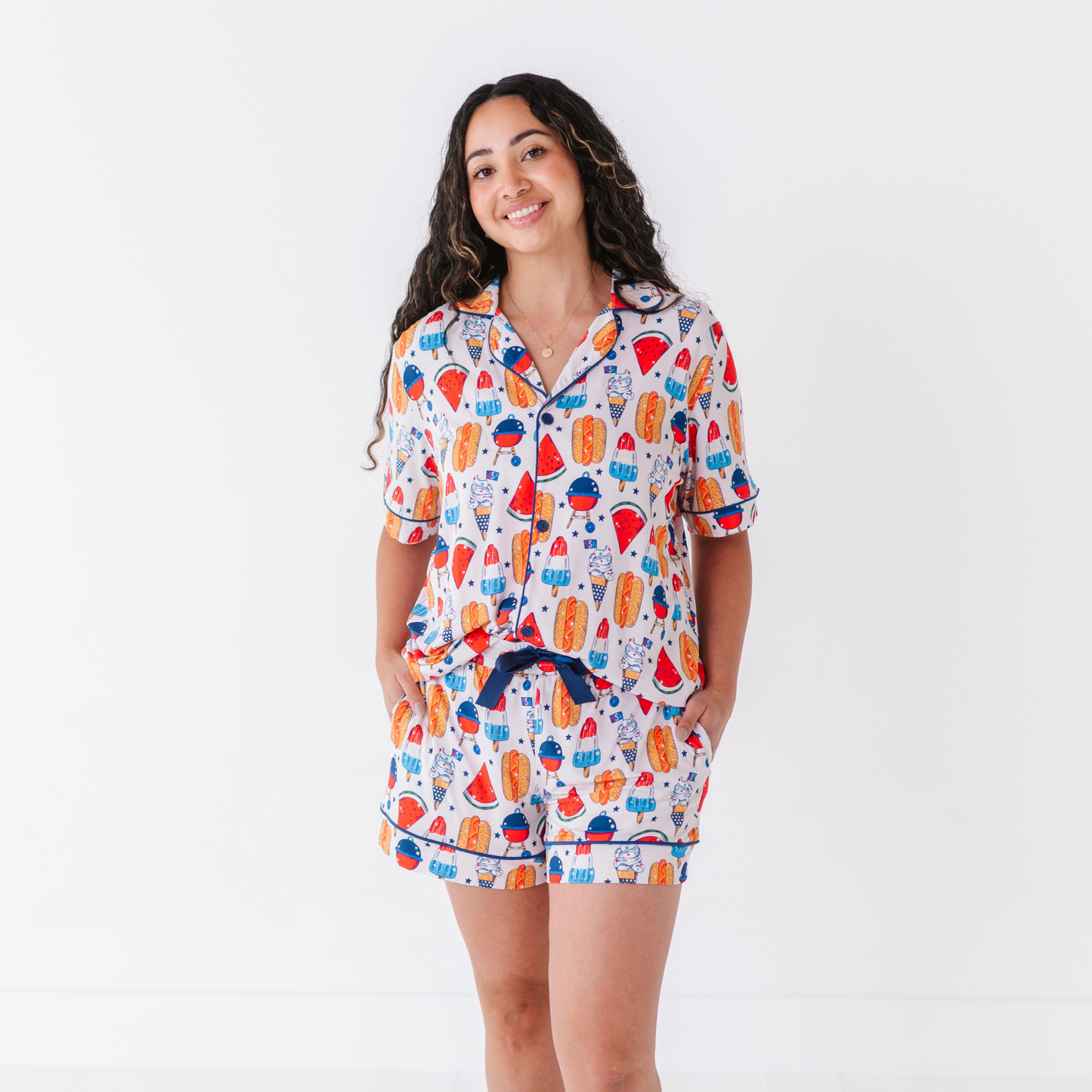 Mom wearing 4th of July hot dog pajamas made from soft bamboo fabric, perfect for matching family sets