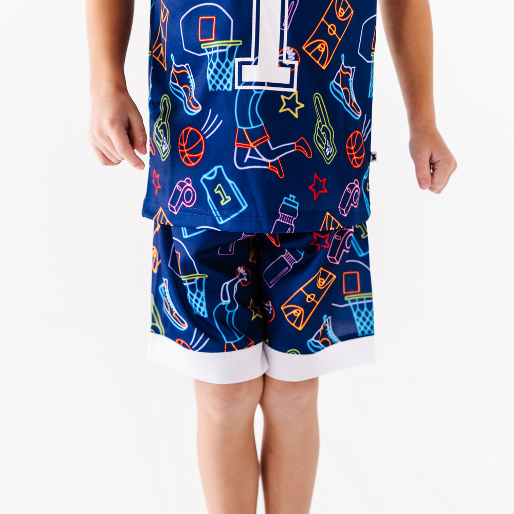 
                      
                        Boy in neon basketball jersey
                      
                    