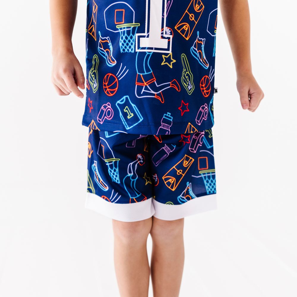 
                
                    Load image into Gallery viewer, Boy in neon basketball jersey
                
            