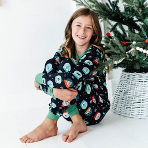 
                
                    Load image into Gallery viewer, Girl in Kiki and Lulu Snow Globe Christmas Family Matching Pajamas 
                
            
