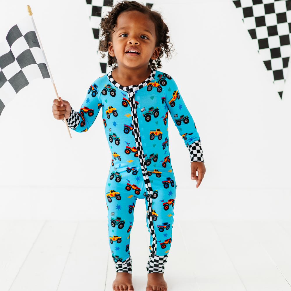 
                      
                        Boy wearing monster truck footies by Kiki and Lulu
                      
                    