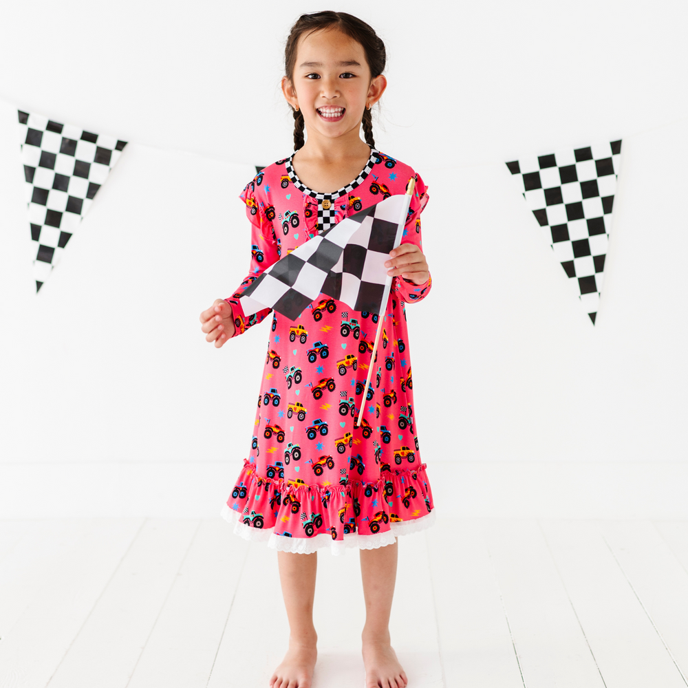 Girl in Monster Truck nightgown by Kiki and Lulu