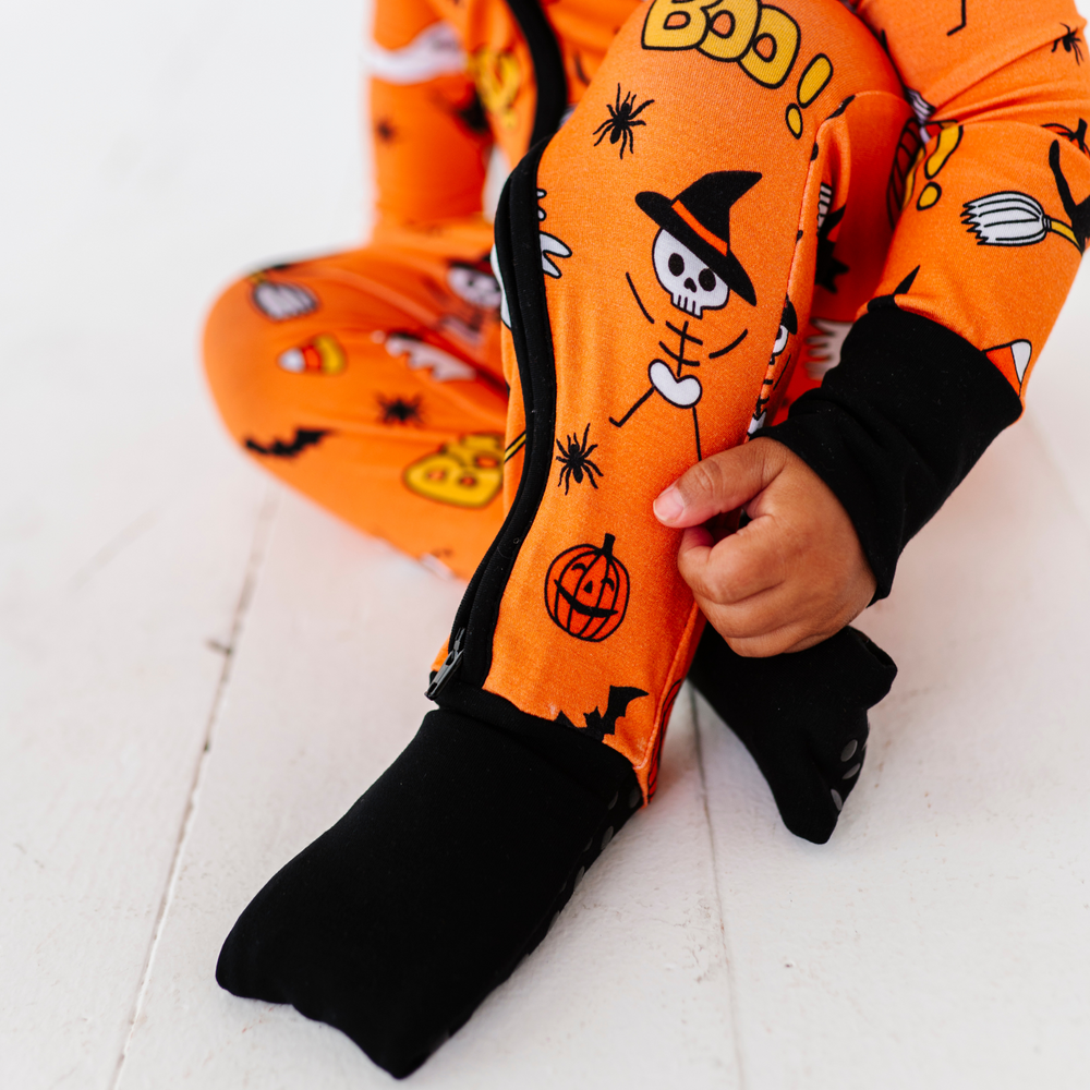 
                      
                        Girl in orange Halloween pajamas by Kiki and Lulu
                      
                    