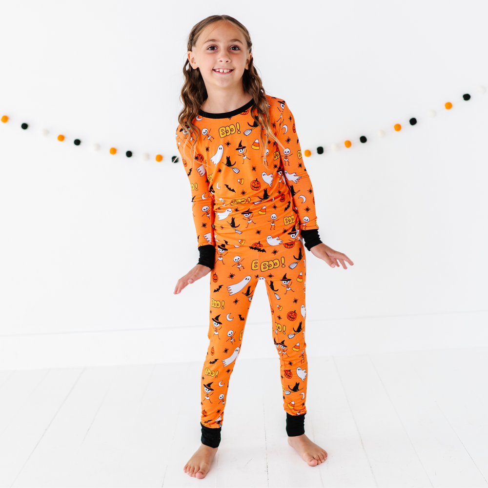 
                      
                        Girl in orange Halloween Pajamas
                      
                    