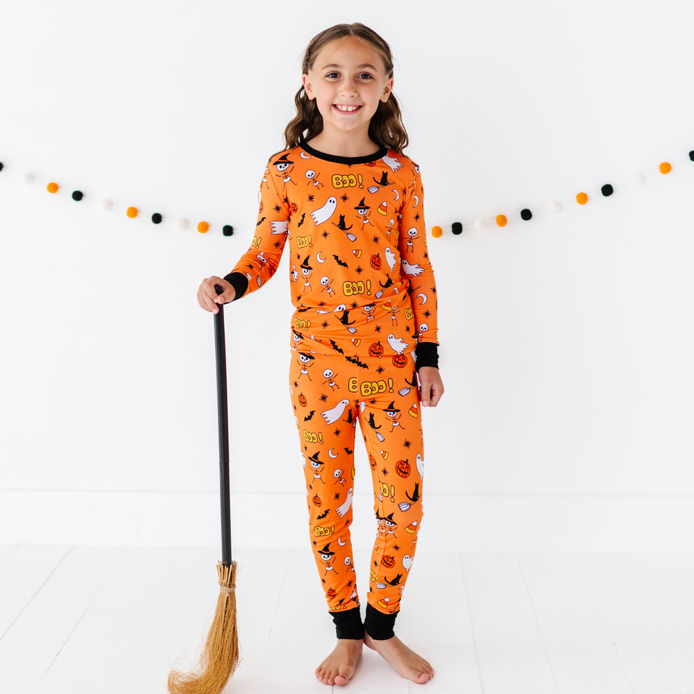 
                      
                        Girl in orange Halloween Pajamas
                      
                    