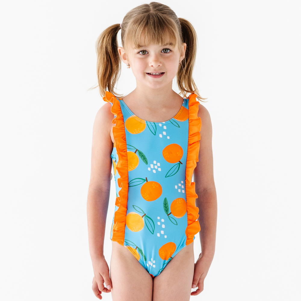 
                      
                        Be My Clementine Girls Swimsuit With Ruffle
                      
                    