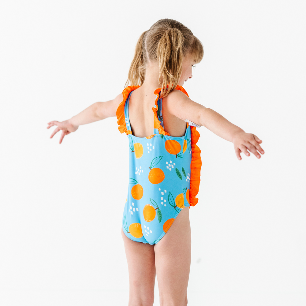 
                      
                        Be My Clementine Girls Swimsuit With Ruffle
                      
                    