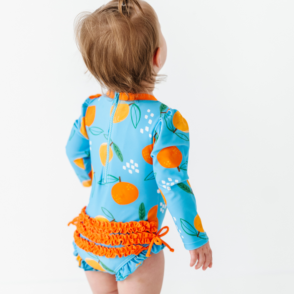 
                      
                        Be My Clementine Long Sleeve Ruffle Swimsuit
                      
                    