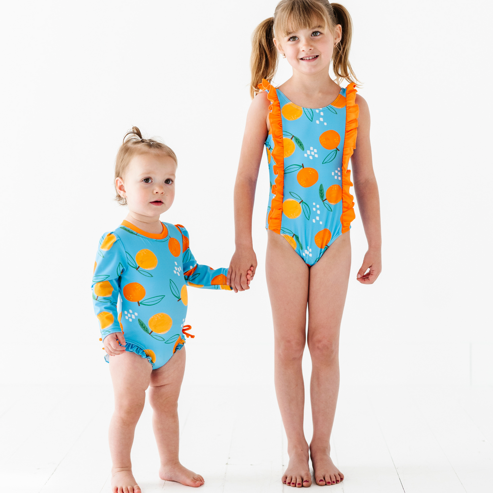 
                      
                        Be My Clementine Long Sleeve Ruffle Swimsuit
                      
                    