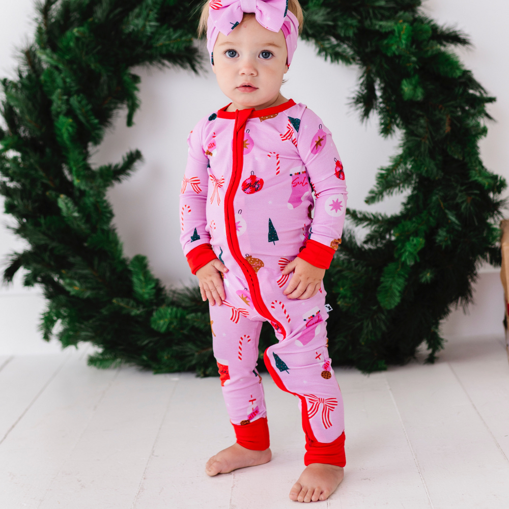 
                      
                        Baby in Pink Christmas pajamas by Kiki and Lulu
                      
                    