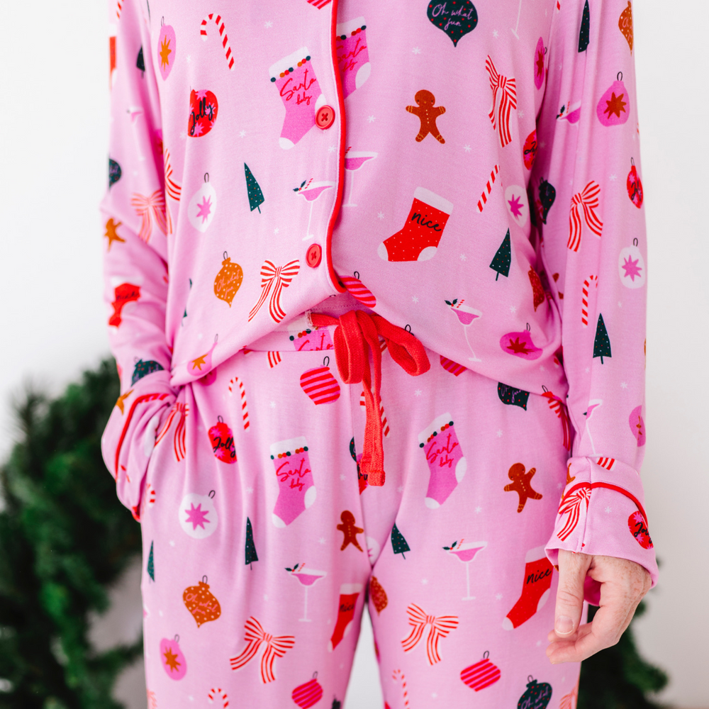 
                      
                        Woman in pink Christmas pajamas by Kiki and Lulu
                      
                    