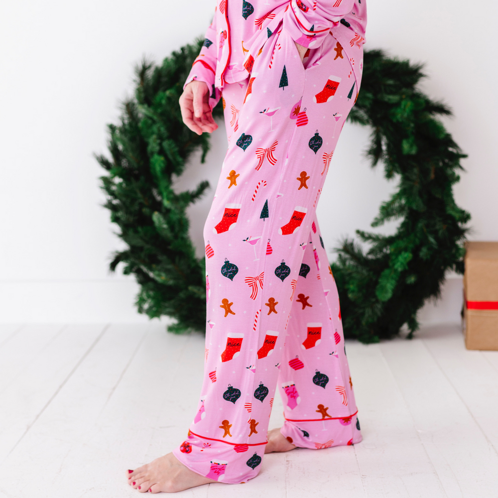 
                      
                        Woman in pink Christmas pajamas by Kiki and Lulu
                      
                    