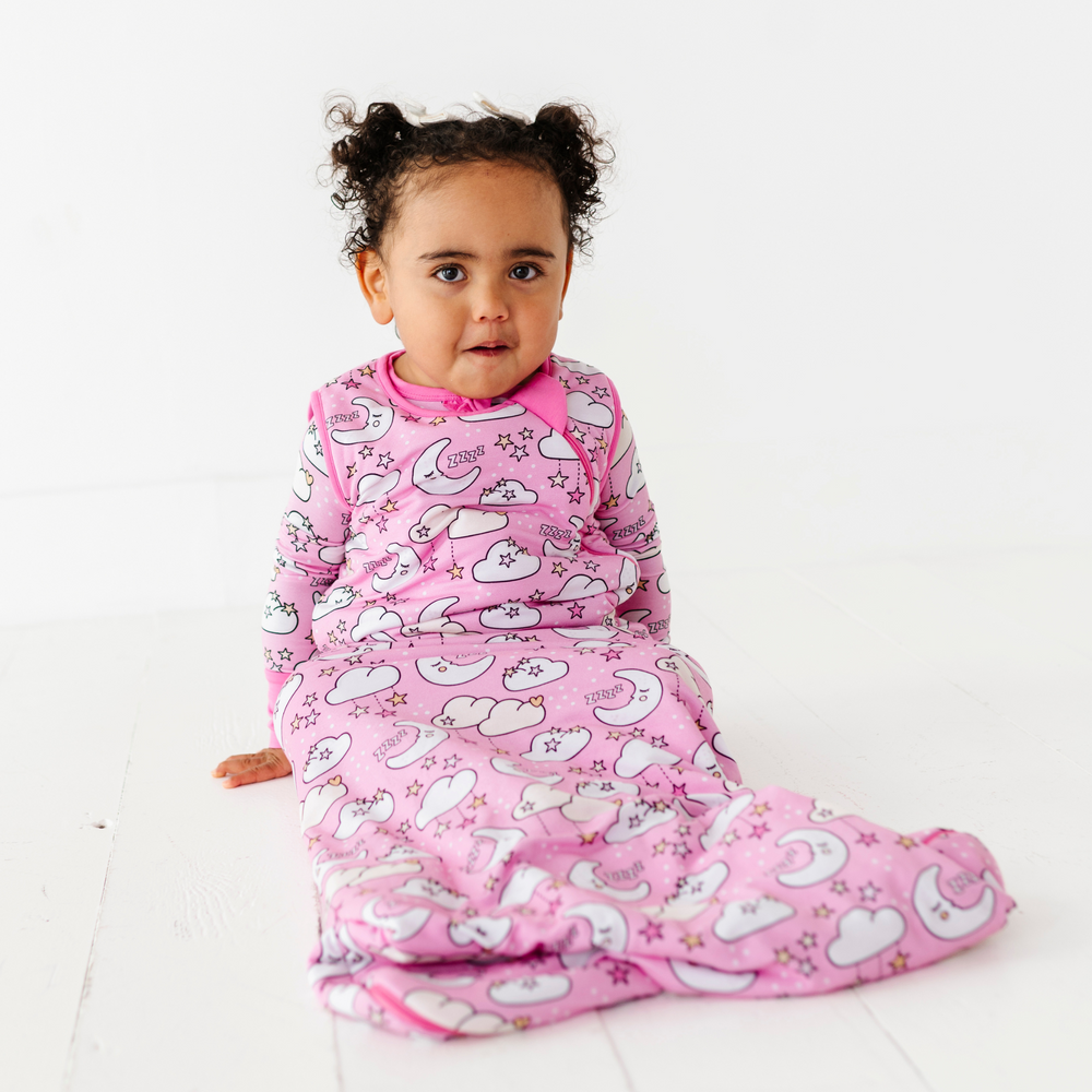 
                      
                        Baby in pink sleep bag by Kiki and Lulu
                      
                    